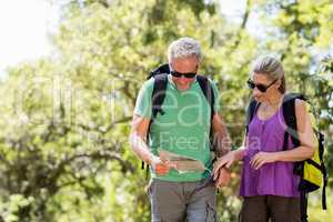 Couple looking a map during a hike