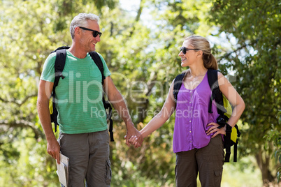 Couple smiling and holding hands each other