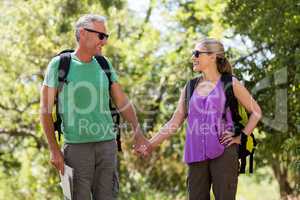 Couple smiling and holding hands each other