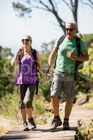 Couple hiking and holding hands each other