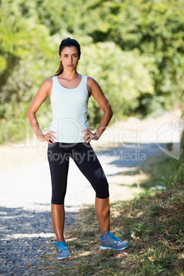 Woman posing with hands on hips