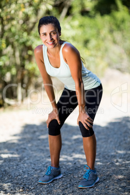 Woman smiling and taking a break during sport