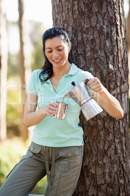 Woman smiling and taking some drink