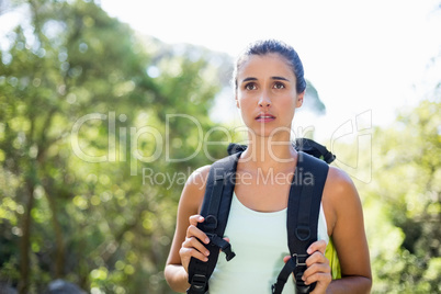 Woman unsmiling posing with her backpack