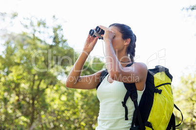 Woman looking something with binoculars