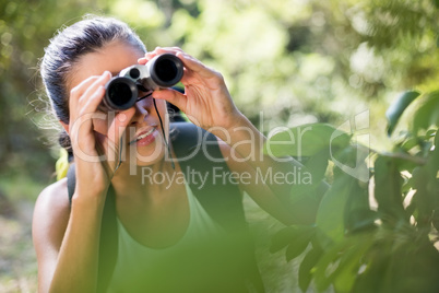 Woman looking something with binoculars