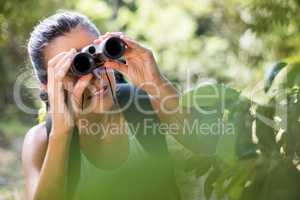 Woman looking something with binoculars