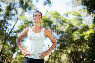 Woman smiling and doing yoga