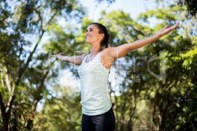 Woman smiling and doing yoga