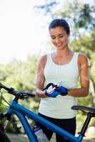 Woman smiling and preparing ride bike