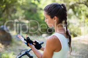 Concentrated woman preparing ride bike