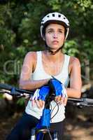 Woman unsmiling posing with her bike