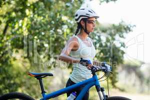 Woman unsmiling posing with her bike