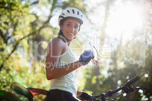 Woman smiling and posing with her bike