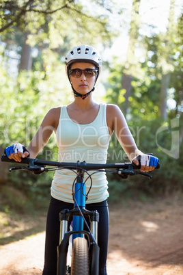 Woman unsmiling posing with her bike