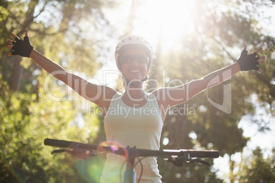 Woman rider smiling and throwing arms