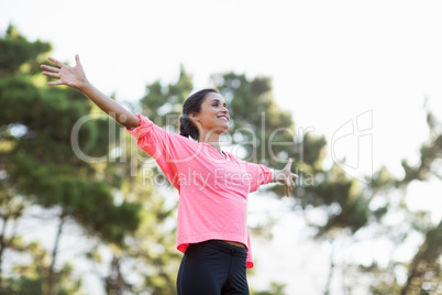 Woman smiling and throwing arms