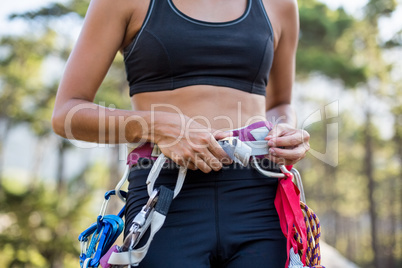 Close up climbing equipment on a woman