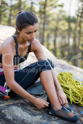 Woman preparing rock climbing