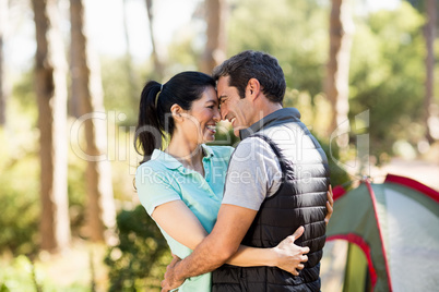 Couple smiling and holding each other