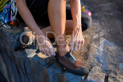 Close up of woman preparing rock climbing