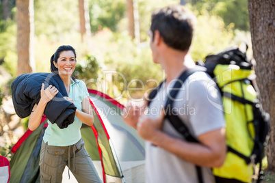 Couple smiling on their camp site