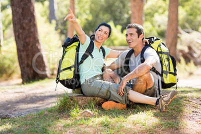 Couple sitting and pointing