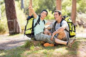 Couple sitting and pointing