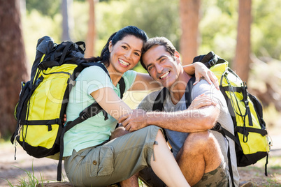 Couple sitting and holding each other