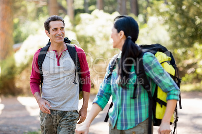 Couple looking each other and hiking