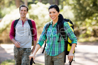 Couple smiling and hiking