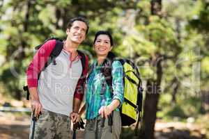 Couple smiling and hiking