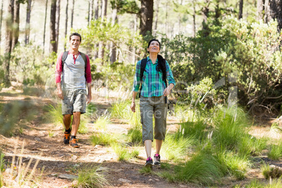 Couple smiling and hiking