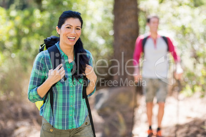 Woman smiling and hiking