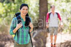 Woman smiling and hiking