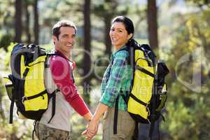 Couple holding hands each other and hiking