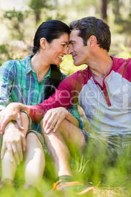 Couple sitting and holding each other