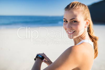 Fit woman wearing smart watch