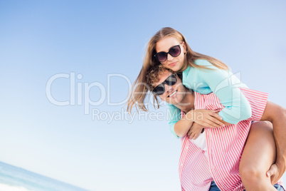 Happy couple posing on the beach