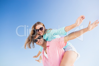 Happy couple posing on the beach