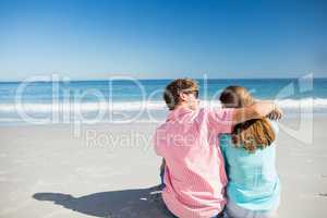 Happy couple posing on the beach