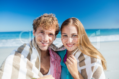 Happy couple posing on the beach