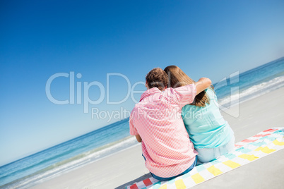 Happy couple posing on the beach