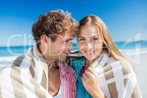 Happy couple posing on the beach