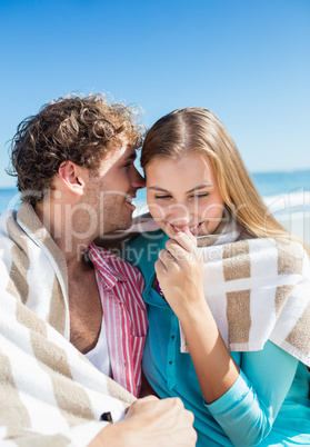 Happy couple posing on the beach