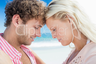 Happy couple posing on the beach