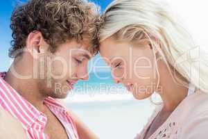 Happy couple posing on the beach