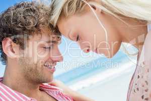 Happy couple posing on the beach