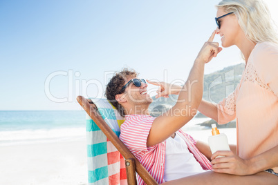 Happy couple posing on the beach