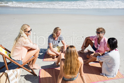 Friends lying on the beach